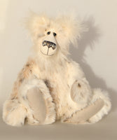 Nooki is a very handsome and cuddly, one of a kind, artist snow bear by Barbara-Ann Bears in wonderfully fluffy mohair and faux fur  Nooki stands 17 inches/42 cm tall and is 13.5 inches/34 cm) sitting.  Nooki is a very handsome teddy bear, he's a bear who wants to rush out into the frozen tundra, hoping to ride a reindeer or a musk ox