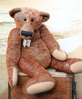 Ole Gravelbelly is a a saggy, loveable and folksy teddy bear made in a beautifully embroidered vintage German mohair by Barbara Ann Bears. Ole Gravelbelly is 21.5 inches (38cm) tall and is 14 inches (35cm) sitting, 12 inches (30cm) slouching. Ole Gravelbelly is a very saggy bear with bucketfuls of character