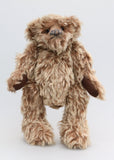 Ormanroyd is a gruff and groovy guy, a veteran artist bear from Barbara-Ann Bears he stands 11.5 inches (29cm) tall and is 8.5 inches (21cm) sitting Ormanroyd was made from beautiful, dense, distressed beige-tipped brown German 'Zotty' mohair. He has brown German wool felt paw pads and green translucent glass eyes