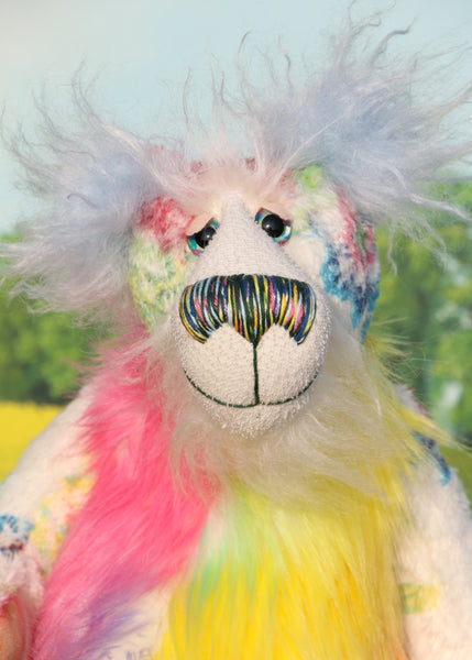 Pascual has beautiful hand painted glass eyes with eyelids, a wonderfully embroidered nose, sewn from individual threads to match his mohair and a wonderful reflective expression with a huge beaming smile