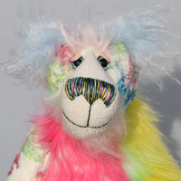 Pascual has beautiful hand painted glass eyes with eyelids, a wonderfully embroidered nose, sewn from individual threads to match his mohair and a wonderful reflective expression with a huge beaming smile