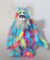 Pedro Piccolo is a humorous and colourful one of a kind artist bear in hand dyed mohair and faux fur by Barbara Ann Bears, he stands 14.5 inches/37 cm tall and is 11 inches/28 cm sitting. He is made from a long and fluffy faux fur in sky blue, yellow, magenta, orange and mauve and a long and fluffy white mohair.