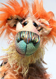 Peter Pickle-Puckle is a kooky, funky and funny one of a kind artist bear in printed cotton, mohair and faux fur by Barbara Ann Bears Peter Pickle-Puckle stands 14.5 inches( 37 cm) tall and is 11 inches (28 cm) sitting, this doesn't include his plumes of wildly fluffy hair on his ears, which add an extra 3.5 inches (9 cm).