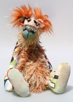 Peter Pickle-Puckle is a kooky, funky and funny one of a kind artist bear in printed cotton, mohair and faux fur by Barbara Ann Bears Peter Pickle-Puckle stands 14.5 inches( 37 cm) tall and is 11 inches (28 cm) sitting, this doesn't include his plumes of wildly fluffy hair on his ears, which add an extra 3.5 inches (9 cm).