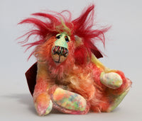 Pinatubo is a very friendly gently colourful and not so fiery one of a kind artist dragon in beautiful hand dyed mohair by Barbara Ann Bears Pinatubo stands 8 inches( 20 cm) tall and is 6.5 inches (16 cm) sitting, this doesn't include his plume of wildly fluffy hair which add an extra 2.5 inches (6 cm). 
