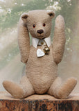 Pomeroy a large and elegant classical, one of a kind, traditional mohair artist teddy bear by Barbara Ann Bears. He stands 23.5 inches (60 cm) tall and is made from gorgeous dense and curly beige mohair with beige suedette paw pads, old amber glass eyes, an impressive embroidered brown nose and the sweetest smile