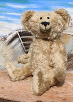 Rory is a very old bear, he was one of our first designs going back to around 1991, he is 15 inches (38cm) tall and is 10.5 inches (27cm) sitting. He is made from blond English mohair and has black glass eyes, leather paw pads and a cheeky smile.