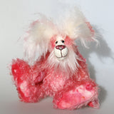 Rosie Rabbit is a very sweet and gentle, one of a kind mohair rabbit by Barbara Ann Bears, she stands 12 inches/30 cm tall and is 8.5 inches/21 cm sitting, her ears are 9 inches/23 cm across the top. Made from beautiful hand dyed pink mohair with long fluffy white mohair used for her face, her ears and her tail