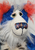 Rudyard Pimpleton has large, beautiful, hand painted eyes with eyelids, a splendid nose embroidered from individual threads to complement his colouring and he has a sweet, friendly smile.