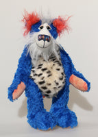 Rudyard Pimpleton is a joyous celebration of colourful happiness, a one of a kind, artist bear by Barbara-Ann Bears in beautiful cobalt blue mohair and faux fur. He stands 14 inches( 36 cm) tall and is 10 inches ( 25 cm) sitting. Rudyard Pimpleton is a wonderful bear, he's exceedingly cheerful and wonderfully colourful