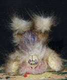 Sammy Snuggles is a very sweet and happy one of a kind artist bear made from faux fur and hand dyed mohair by Barbara Ann Bears. Sammy Snuggles stands just 6.25 inches( 15 cm) tall and is 5 inches (13 cm) sitting, this doesn't include his plume of wildly fluffy hair which adds an extra 2.5 inches (6 cm).