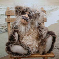 Sir Cadbury Fluffybum is a very sweet and cuddly, one of a kind, artist teddy bear in gorgeous faux fur and mohair by Barbara-Ann Bears. Sir Cadbury Fluffybum stands 14 inches (35 cm) tall and is 11 inches (28 cm) sitting. 