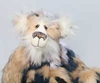Sir Samuel Snuggleford is a calm and very friendly one of a kind, artist teddy bear in by Barbara-Ann Bears, he stands 17 inches/43 cm tall. Sir Samuel is mostly made from a very exciting gently coloured faux fur, it gives the impression of being in patches but is a continuous piece matched with long fluffy white mohair