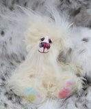 Snowdrop is a particularly small and adorable snowbear, a one of a kind artist bear in fluffy, snowy silk and mohair by Barbara-Ann Bears. Snowdrop stands just 5 inches (12 cm) tall and is 4 inches (10 cm) sitting, this doesn't include the long plumes of white mohair that swirl about her head, these add a further 3 inches (7.5cm).