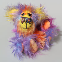 Solly, a bright, cheerful and comical, one of a kind, artist teddy bear by Barbara-Ann Bears in beautifully coloured hand-dyed mohair. Solly stands 7.5 inches( 19 cm) tall and is 5.5 inches ( 14 cm) sitting.