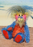 Sparky McTickle is a wild and wonderful bear, full of colourful happiness, a one of a kind, mohair artist teddy bear by Barbara-Ann Bears, he stands 9 inches( 23 cm) tall and is 7 inches ( 18 cm) sitting Sparky McTickle is made from hand-dyed blue, orange, pink and yellow mohair with a long plume of feathery faux fur 