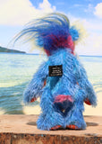 Sparky McTickle is a wild and wonderful bear, full of colourful happiness, a one of a kind, mohair artist teddy bear by Barbara-Ann Bears, he stands 9 inches( 23 cm) tall and is 7 inches ( 18 cm) sitting Sparky McTickle is made from hand-dyed blue, orange, pink and yellow mohair with a long plume of feathery faux fur 