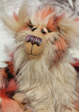 Stanley is the most handsome and endearing, one of a kind, artist bear by Barbara-Ann Bears, he stands 14.5 inches (37 cm) tall and is 11.5 inches (29 cm) sitting. Stanley is made from luxurious long faux furs in rose, cream, peach, pink and black, coupled with a long fluffy blond mohair with a warmer backcloth