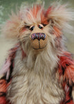 Stanley is the most handsome and endearing, one of a kind, artist bear by Barbara-Ann Bears, he stands 14.5 inches (37 cm) tall and is 11.5 inches (29 cm) sitting. Stanley is made from luxurious long faux furs in rose, cream, peach, pink and black, coupled with a long fluffy blond mohair with a warmer backcloth