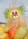 Sunshine is a wonderfully happy and colourful one of a kind mohair artist teddy bear by Barbara-Ann Bears, he stands 8.5 inches(21 cm) tall and is 6 inches (15 cm) sitting. Sunshine is made from several beautiful distressed mohairs hand dyed sunny yellow, orange and blue with a long fluffy white mohair for his face