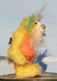 Sunshine is a wonderfully happy and colourful one of a kind mohair artist teddy bear by Barbara-Ann Bears, he stands 8.5 inches(21 cm) tall and is 6 inches (15 cm) sitting. Sunshine is made from several beautiful distressed mohairs hand dyed sunny yellow, orange and blue with a long fluffy white mohair for his face
