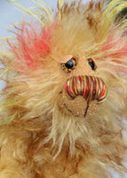 Sweeter Peter is a gorgeous teddy bear, pocket-sized yet full of character, a one of a kind artist bear by Barbara-Ann Bears in very fluffy, brown tipped gold mohair with colourful ears and tail, hand painted eyes with hand coloured eyelids Sweeter Peter stands just 6 inches(15 cm) tall and is 4.5 inches(12 cm) sitting.