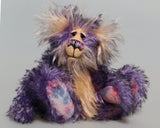 Swizzel is a small, cute and very happy one of a kind artist teddy bear by Barbara-Ann Bears, he stands just 8 inches( 20 cm) tall and is 6 inches ( 15 cm) sitting. He is made from curly black-tipped purple mohair and his face, tummy, the fronts of his ears and the underside of his tail are a long peach coloured mohair
