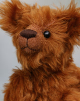 Timothy Tucker is a very sweet and charming, one of a kind artist teddy bear by Barbara Ann Bears in gorgeous English mohair, like a young bear cub. He stands 10.5 inches/26 cm tall and is 8 inches/20 cm sitting. Timothy Tucker is made from a beautiful, dense, distressed, warm cinnamon coloured English mohair