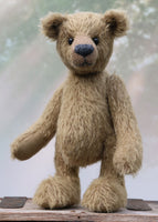 Toby Tumble is a very sweet and friendly, almost traditional, one of a kind, mohair artist teddy bear by Barbara Ann Bears. He stands 10 inches/25 cm tall and is 7.5 inches/19 cm sitting.  is made from a beautiful, quite sparse, straight pile, soft greeny-brown mohair, it's colour is a bit like an old army tunic 