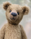 Toby Tumble is a very sweet and friendly, almost traditional, one of a kind, mohair artist teddy bear by Barbara Ann Bears. He stands 10 inches/25 cm tall and is 7.5 inches/19 cm sitting.  is made from a beautiful, quite sparse, straight pile, soft greeny-brown mohair, it's colour is a bit like an old army tunic 