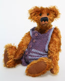 Tom Barleycorn is a mohair teddy bear in a swimsuit by Barbara Ann Bears