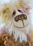 Tom Duchart has beautiful hand painted eyes with eyelids, a splendid nose embroidered from individual threads to match his colouring and he has a huge, friendly smile, he has a somewhat nonplussed expression, as if he was plucked from his natural habitat on the wild, high moors and plonked in a bear maker's cottage near the sea. He seems to be asking, 'How did I get here? Where is this comfortable house? What am I doing here?' But he'll be fine with some love, hugs and bilberry sandwiches 