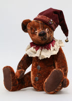 The Frederick Teddy Bear pattern makes a sweet traditional Barbara-Ann Bear about 15 inches (38cm) tall. This one in mahogany vintage mohair and with a clown hat and lace collar