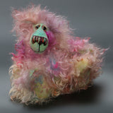 Tristan Tickles is a small, sweet and fluffy, beautifully coloured, one of a kind, hand dyed mohair artist bear by Barbara-Ann Bears. Tristan Tickles stands just 6 inches (15 cm) tall and is 5 inches (13 cm) sitting. 