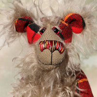 Wallace is a very handsome and dignified, one of a kind, artist bear by Barbara-Ann Bears, he stands 16 inches(41 cm) tall and is 12 inches(30 cm) sitting. He is made from the Wallace tartan coupled with a long, fluffy greyish-beige mohair which forms his face, tummy, the backs of his ears and the underside of his tail