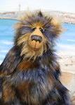 Walter Klondike is a shaggy, wild and wonderful, one of a kind, artist teddy bear by Barbara-Ann Bears. He's made from long shaggy dense faux fur which is navy blue at the base with gold, ice blue and black tipping. Moritz is a large and heavy teddy bear, he stands 19 inches (48 cm) tall and 14.5 inches (38 cm) sitting