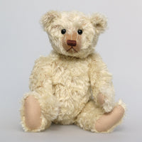 Warburton is a very sweet and loving classical, traditional mohair artist teddy bear by Barbara Ann Bears, he is 17 inches (43cm) tall and is 13 inches (33cm) sitting. Warburton is made from distressed creamy white mohair with beige wool felt paw pads, reproduction black boot button eyes and an embroidered brown nose