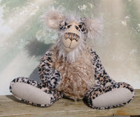 Wentworth is mostly made from a beautiful, bobbly animal print faux fur with black spots on a background of two subtly different shades of beige, similar to a cheetah's. His face, the fronts of his ears and the underside of his tail are a very long and feathery pale beige mohair and his tummy is made from a very long wildly tousled stone coloured faux fur. Wentworth has coordinating paw pads made from beige German wool felt.