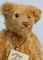 Wilfred is made from a wonderful antique gold mohair, it is a medium length, and a little fluffy and distressed, it's not a type of mohair that is made anymore which makes him just that little bit extra special.  Wilfred has gorgeous amber glass eyes, a splendid, carefully embroidered brown nose and a relaxed and demure expression. Wilfred was the first of our bears to have a beard, we were about to trim it off but thought it rather suited him
