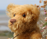 Wilfred is made from a wonderful antique gold mohair, it is a medium length, and a little fluffy and distressed, it's not a type of mohair that is made anymore which makes him just that little bit extra special. Wilfred has gorgeous amber glass eyes, a splendid, carefully embroidered brown nose and a relaxed and demure expression. Wilfred was the first of our bears to have a beard, we were about to trim it off but thought it rather suited him