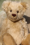 Willoughby is a sweet and cuddly, traditional one of a kind, artist teddy bear made in splendid German mohair by Barbara Ann Bears, he stands 18.5 inches (47cm) tall and is 13.5 inches (34cm) sitting. He is made from dense, blond, straight pile, German mohair with beige wool-felt paw pads & hand painted beautiful eyes