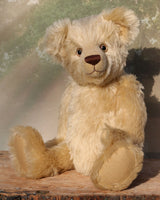 Willoughby is a sweet and cuddly, traditional one of a kind, artist teddy bear made in splendid German mohair by Barbara Ann Bears, he stands 18.5 inches (47cm) tall and is 13.5 inches (34cm) sitting. He is made from dense, blond, straight pile, German mohair with beige wool-felt paw pads & hand painted beautiful eyes