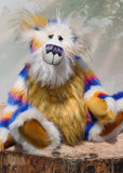 Zebedee is a very shaggy, stripy and colourful, one of a kind, artist teddy bear, he is quite a large and heavy teddy bear, he stands 18.5 inches (47 cm) tall and is 14.5 inches (37 cm) sitting.  Zebedee is made from faux fur in bands of white, magenta, sunny orange and royal blue with white mohair and  orange faux fur
