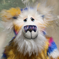 Zebedee has large, beautiful, hand painted glass eyes with hand coloured eyelids, he has a carefully embroidered nose that incorporates all of his colours and a sweet, thoughtful smile