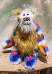 Zebedee is a very shaggy, stripy and colourful, one of a kind, artist teddy bear, he is quite a large and heavy teddy bear, he stands 18.5 inches (47 cm) tall and is 14.5 inches (37 cm) sitting.  Zebedee is made from faux fur in bands of white, magenta, sunny orange and royal blue with white mohair and  orange faux fur