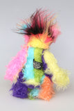 Zoiks! is a rather colourful and comical one of a kind artist bear in beautiful, fluffy hand dyed mohair and faux fur by Barbara Ann Bears. Zoiks! stands 10.5 inches( 33 cm) tall and is 8 inches (20 cm) sitting, this doesn't include his plumes of hair which add another 3 inches/ 7.5cm.