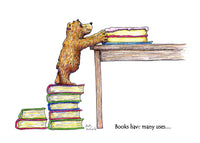 Books Have Many Uses... this greeting card shows a teddy bear using them to make steps to get to a beautiful cake on a table