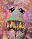 Cezanne is a gentle, elegant and delicately colourful, one of a kind, hand dyed mohair, shaggy artist bear by Barbara-Ann Bears. Cezanne stands 16.5 inches (40 cm) tall and is 12 inches (30 cm) sitting.